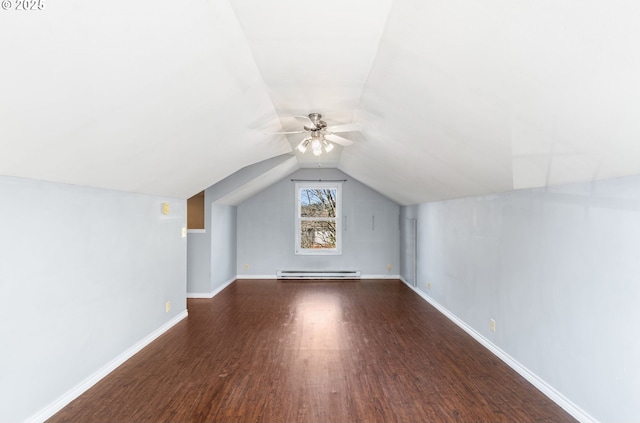 additional living space featuring ceiling fan, baseboard heating, dark hardwood / wood-style flooring, and lofted ceiling