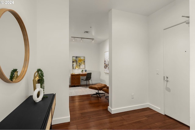 foyer entrance featuring dark hardwood / wood-style floors