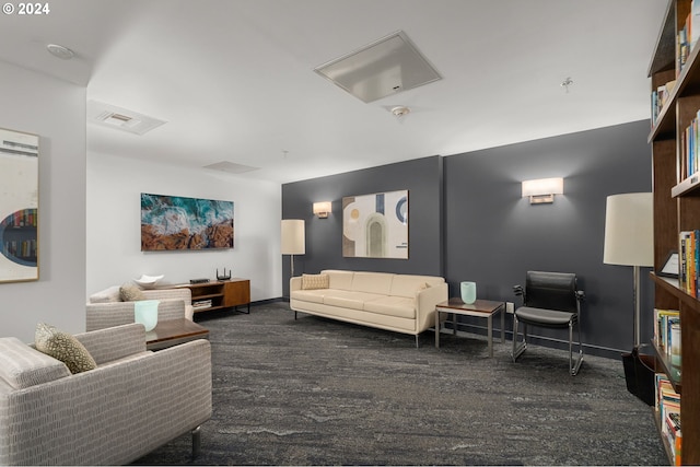 living room featuring dark colored carpet