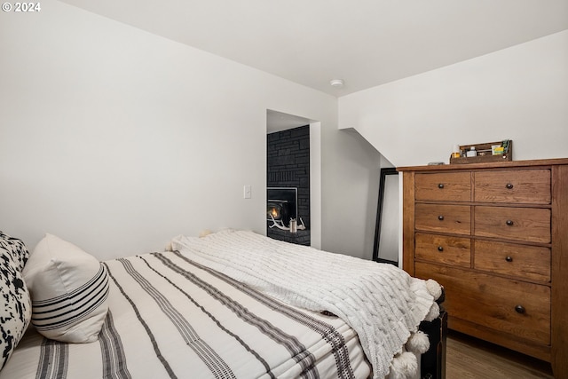 bedroom with dark hardwood / wood-style floors