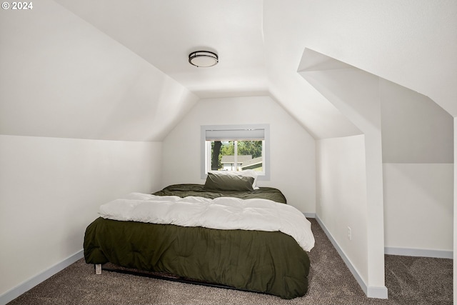 carpeted bedroom with vaulted ceiling