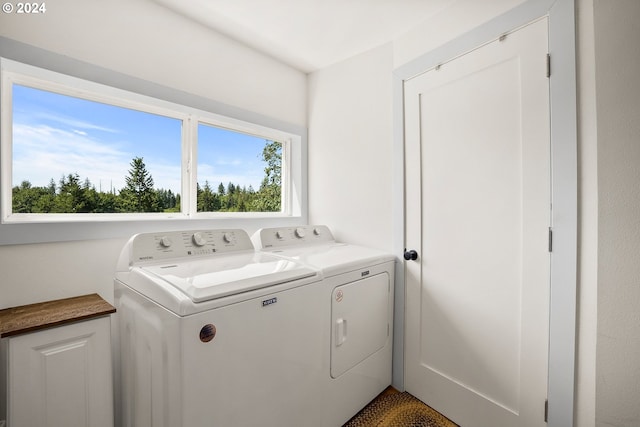 laundry area with washing machine and dryer