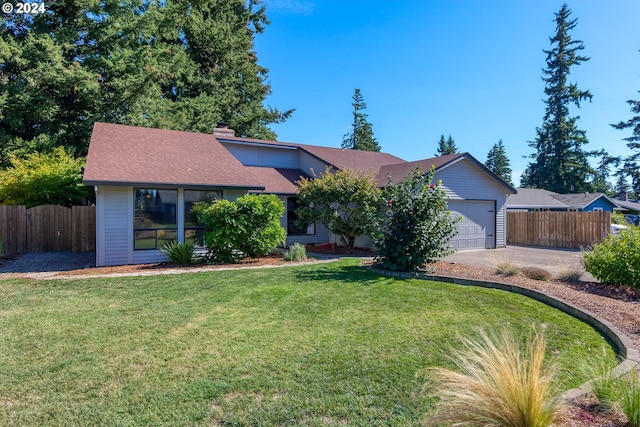 ranch-style home featuring a front yard and a garage