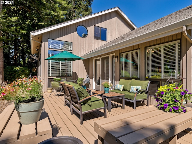 wooden deck featuring outdoor lounge area