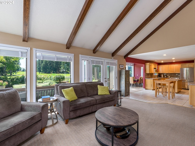 tiled living room with high vaulted ceiling, french doors, and beamed ceiling