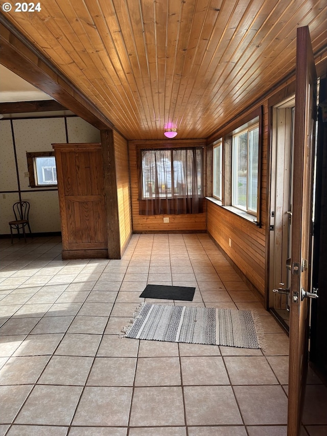 unfurnished sunroom with wooden ceiling