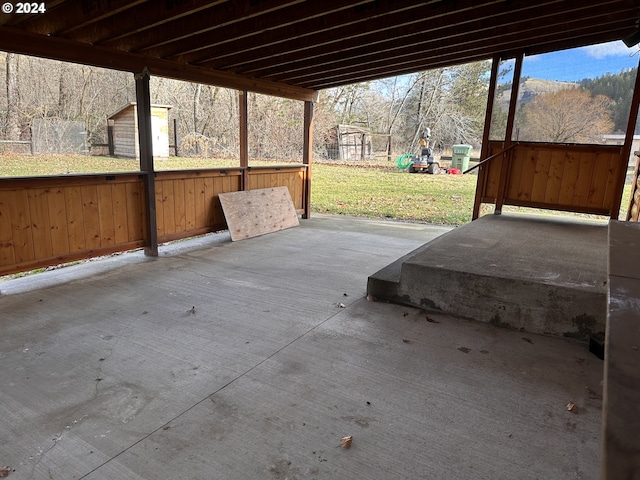 view of patio / terrace featuring a storage shed