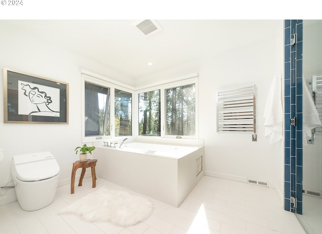 bathroom with tile patterned flooring, separate shower and tub, and toilet