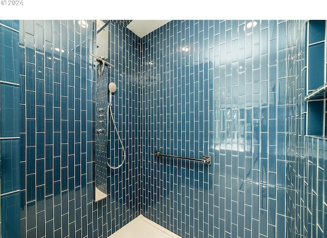 bathroom with tiled shower