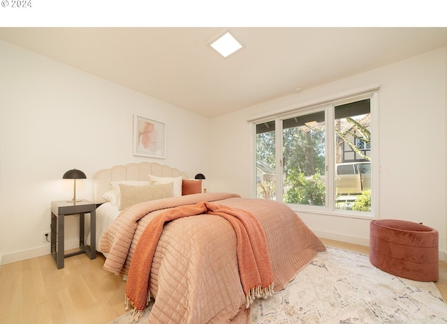 bedroom with light hardwood / wood-style floors