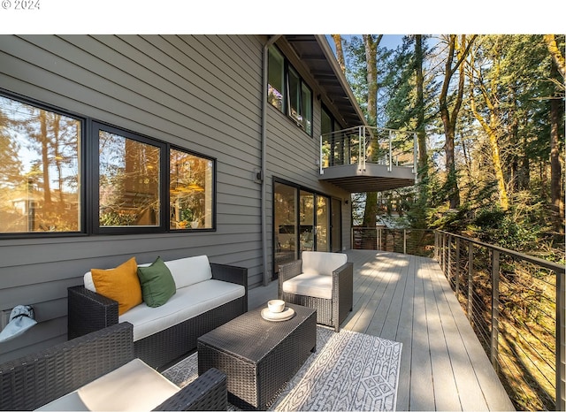 wooden terrace featuring an outdoor living space