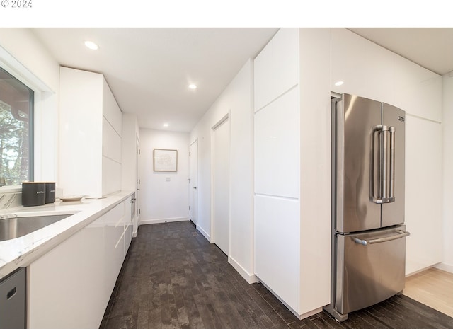 hall featuring dark hardwood / wood-style flooring and sink