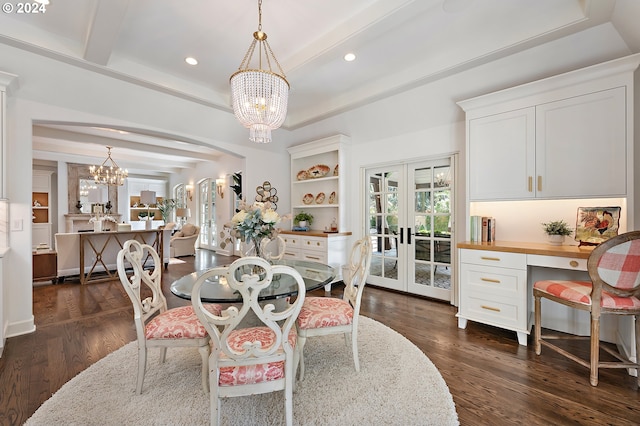 dining space featuring dark wood-type flooring, beam ceiling, an inviting chandelier, and french doors