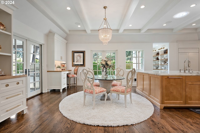 dining space featuring plenty of natural light, dark hardwood / wood-style flooring, french doors, and beam ceiling