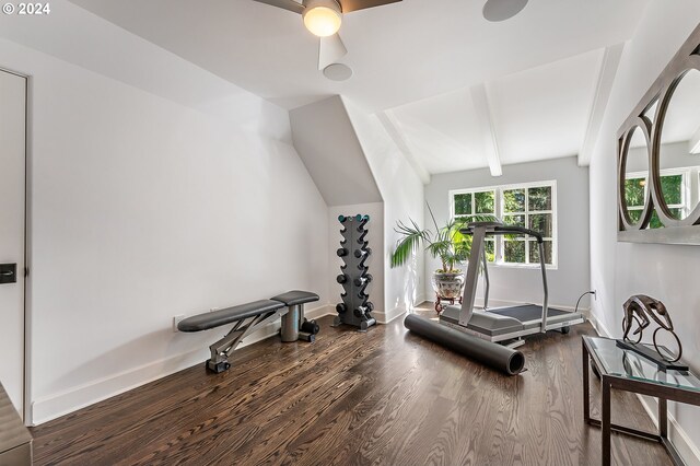 workout area with vaulted ceiling, ceiling fan, and dark wood-type flooring