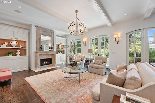 living room featuring dark hardwood / wood-style flooring, a premium fireplace, beam ceiling, and a healthy amount of sunlight