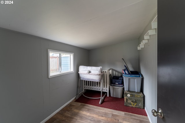 bedroom with hardwood / wood-style floors