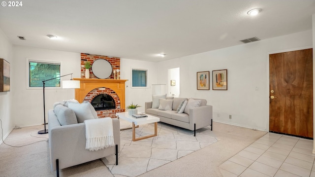 carpeted living room featuring a fireplace