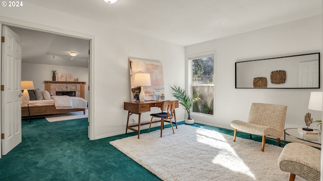 living area with dark colored carpet