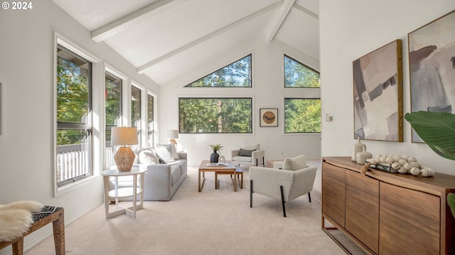 sunroom featuring lofted ceiling with beams and a healthy amount of sunlight