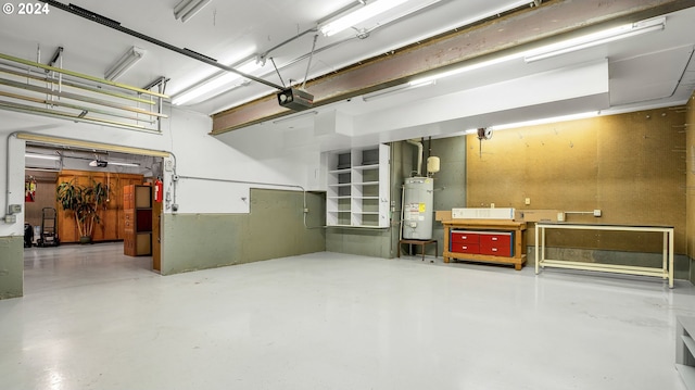 garage featuring gas water heater and a garage door opener