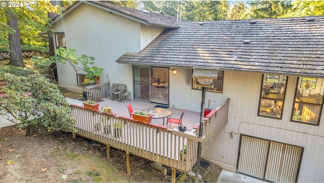 back of house featuring a deck