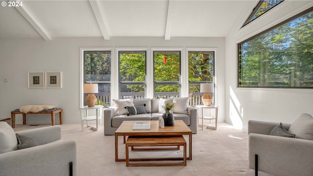 sunroom with plenty of natural light and lofted ceiling with beams