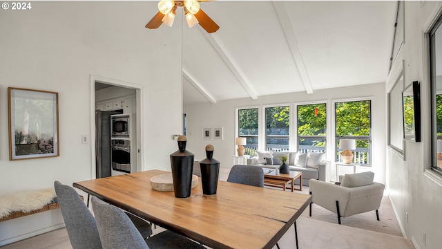 carpeted dining room with high vaulted ceiling, beam ceiling, and ceiling fan