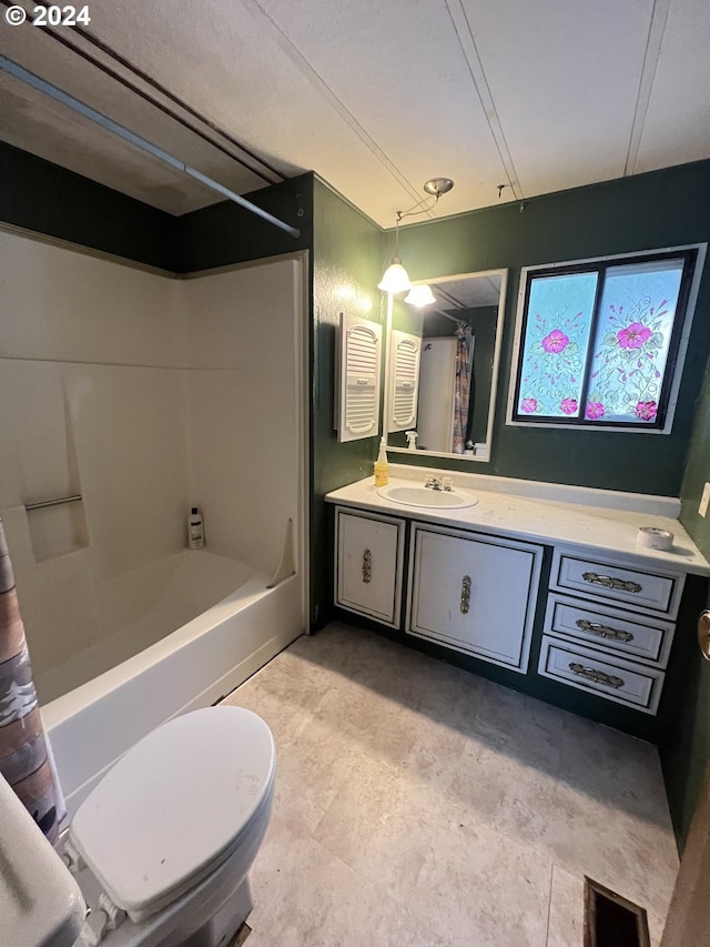 full bathroom with toilet, shower / tub combo, and vanity