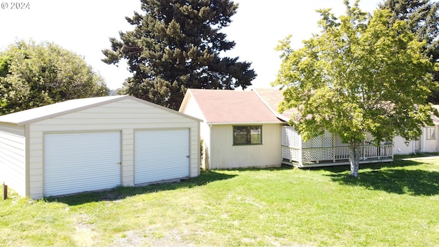 garage with a yard