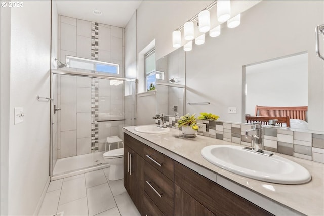 full bath with toilet, a stall shower, double vanity, and tile patterned floors