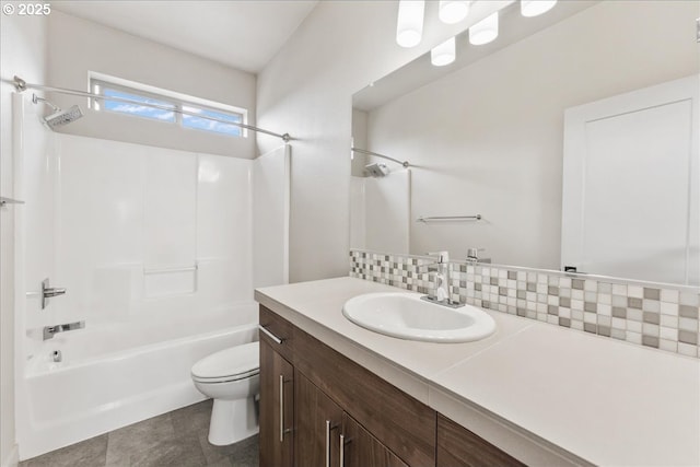 full bath featuring toilet, shower / tub combination, vanity, and backsplash