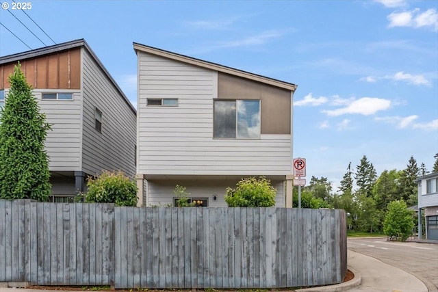 view of property exterior with fence