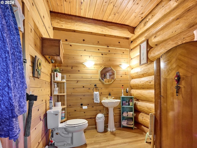 bathroom featuring wood ceiling, toilet, wood-type flooring, rustic walls, and wood walls