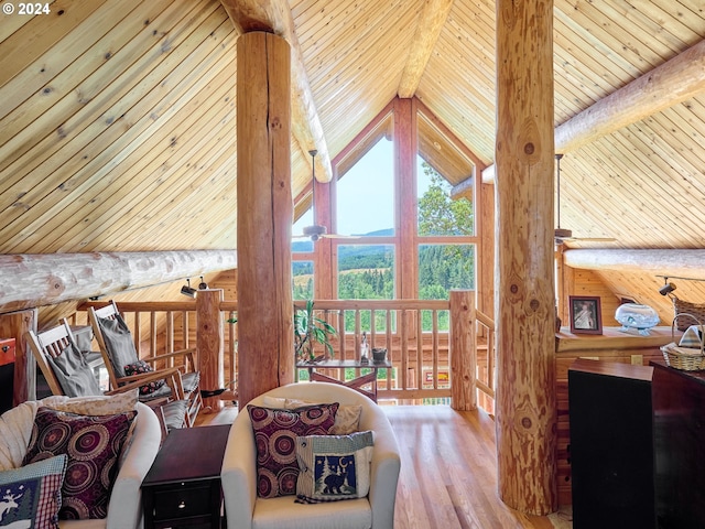 living room featuring high vaulted ceiling, hardwood / wood-style floors, wooden ceiling, and beam ceiling