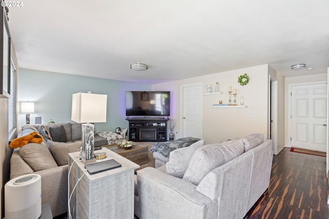 living room with dark hardwood / wood-style floors