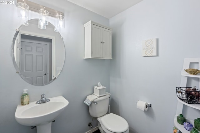 bathroom featuring sink and toilet