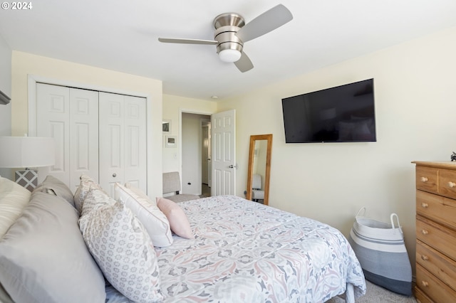 carpeted bedroom with a closet and ceiling fan