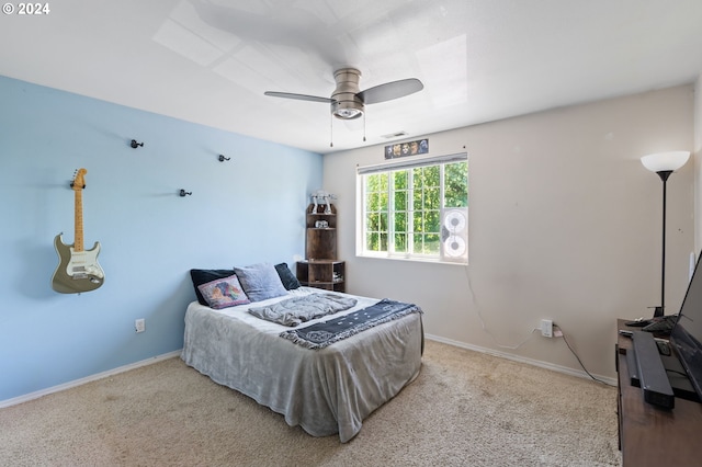 bedroom with ceiling fan and light colored carpet