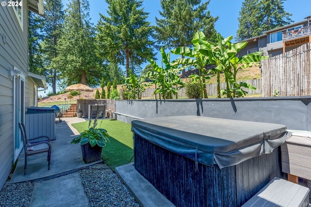 view of patio / terrace with a hot tub