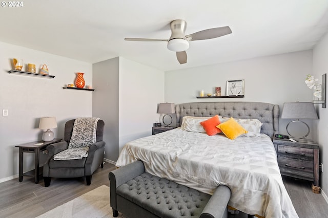 bedroom with wood-type flooring and ceiling fan