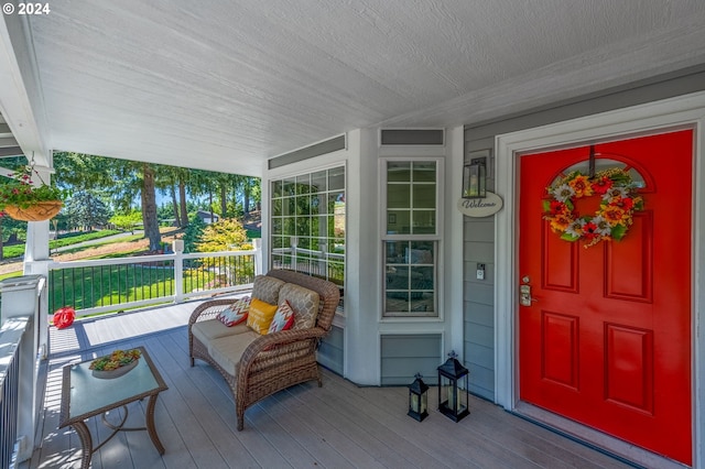 property entrance featuring a porch