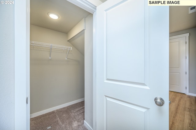 spacious closet with carpet and visible vents