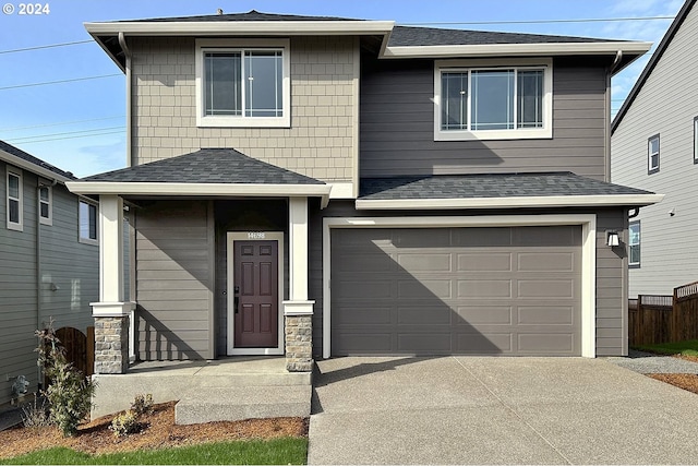 front of property with a garage