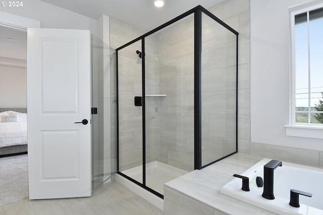 bathroom with tile flooring and plus walk in shower