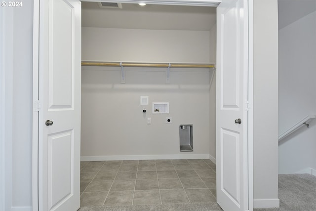 laundry area with gas dryer hookup, light tile flooring, hookup for an electric dryer, and hookup for a washing machine