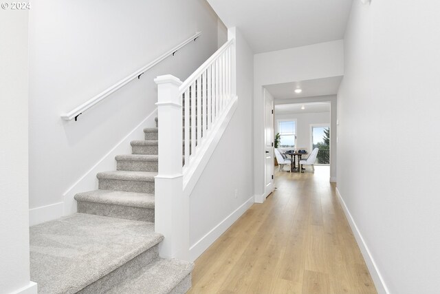 staircase with light wood-type flooring