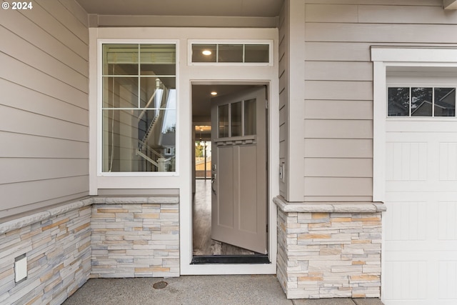 entrance to property featuring a garage