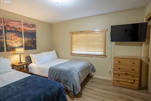 bedroom featuring wood-type flooring