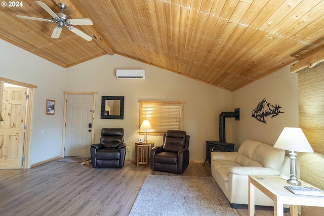 living room featuring vaulted ceiling, a wall mounted AC, ceiling fan, light hardwood / wood-style floors, and a wood stove